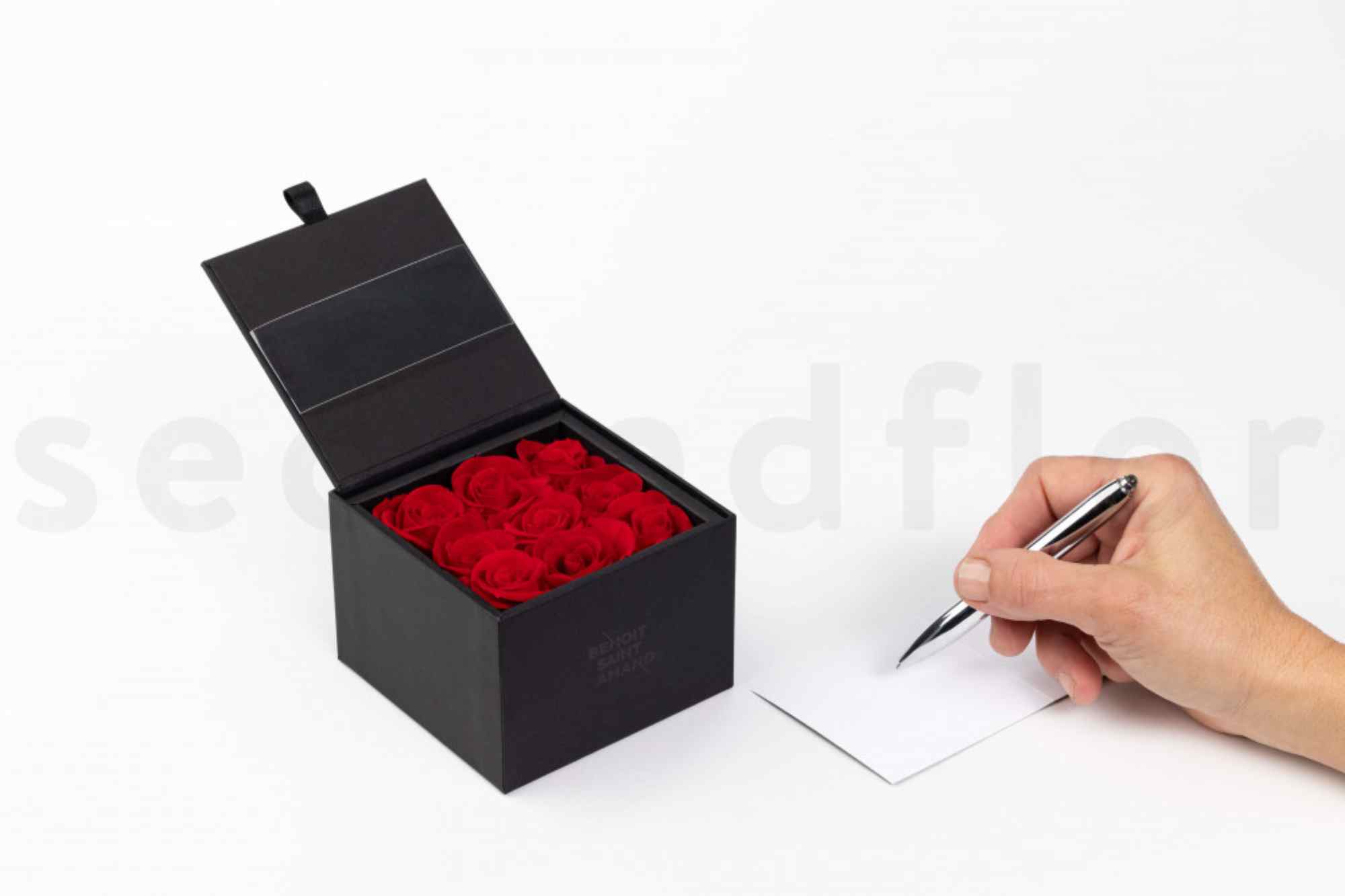 1 box with red preserved flowers in it it is a gift box sold wholesale